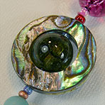 Abalone Saturn composed of Abalone and quartz crystal elements