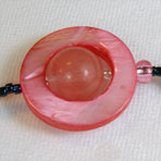 Pink Saturn composed of quartz and mother of pearl elements